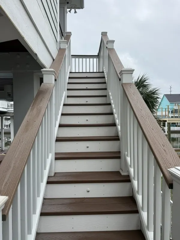 Washed composite stairs with white railings