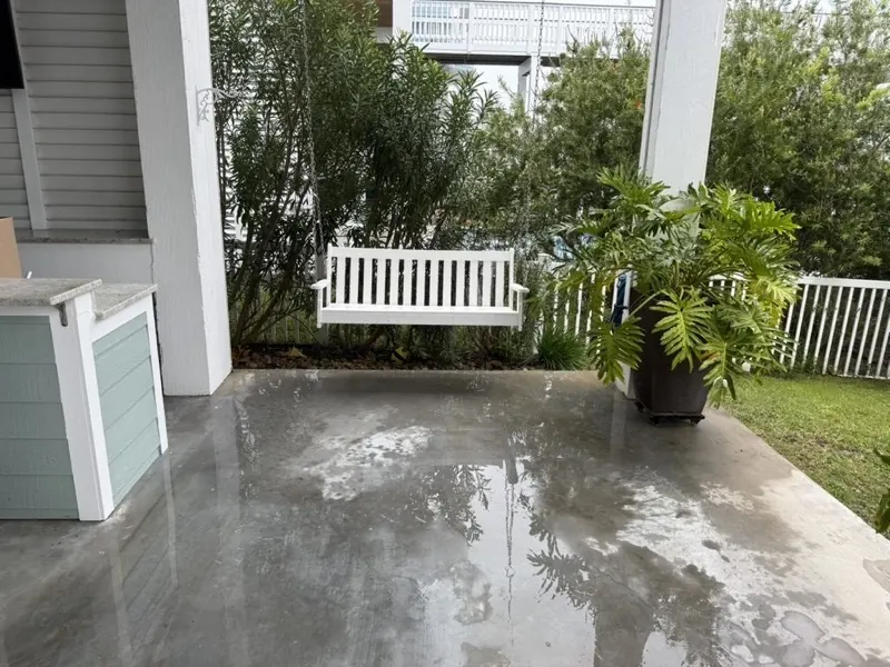Freshly washed patio with a porch swing