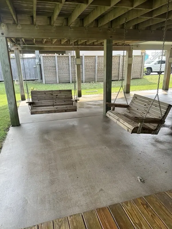 After: clean porch swings and washed concrete